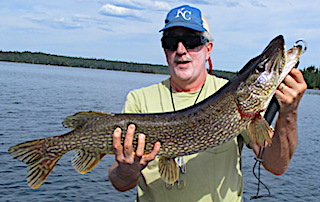 BIG Northern Pike Quest Fishing by Kris Gamble at Fireside Lodge in Canada